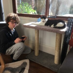 Joe and Murphy pose with their DIY cat scratching post